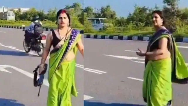 Mu Buhinde: Umugore yagaragaye atwaye imbunda mu ruhame